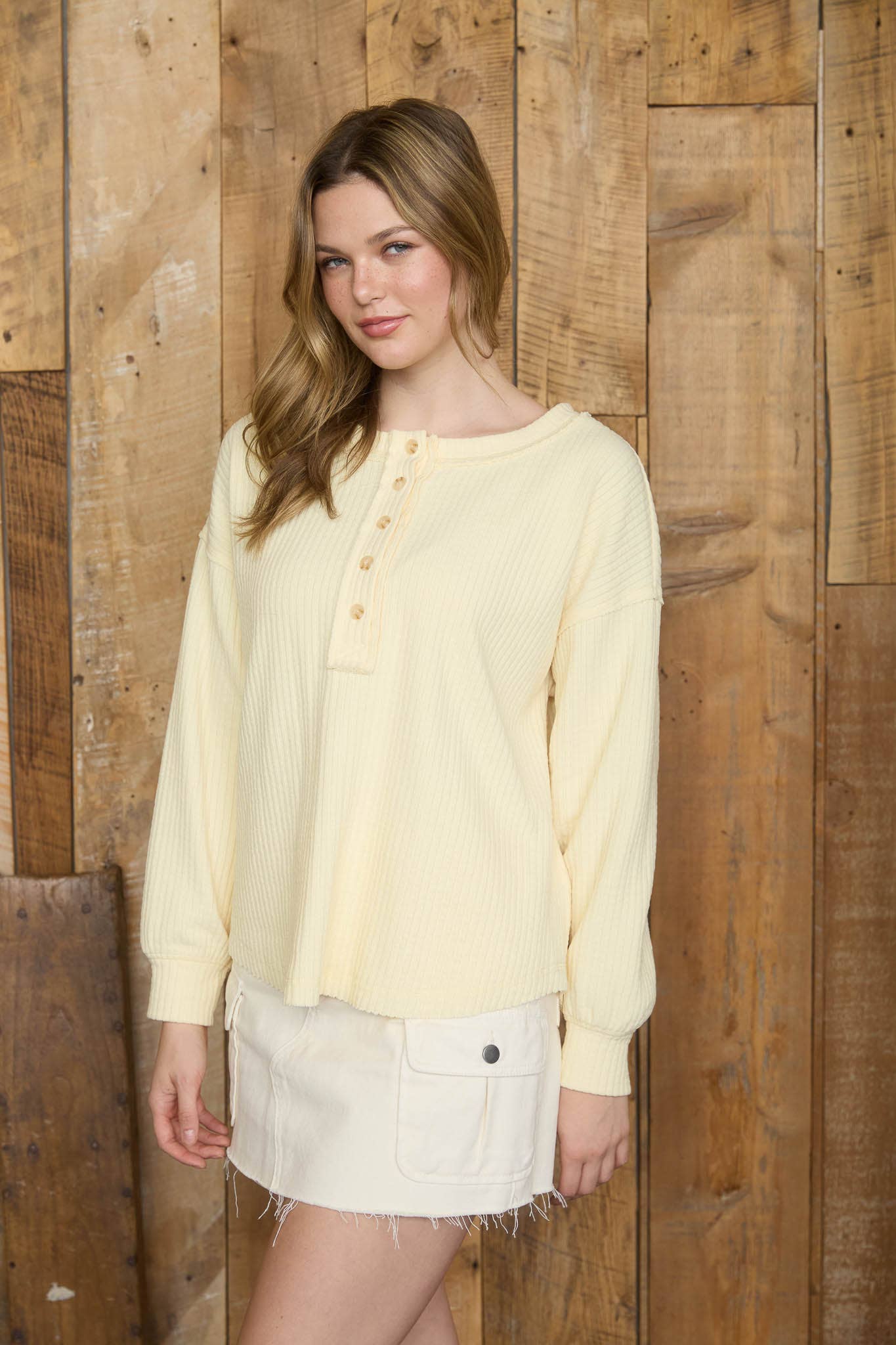 RIBBED HENLEY LONG SLEEVE EXPOSED SEAM KNIT TOP