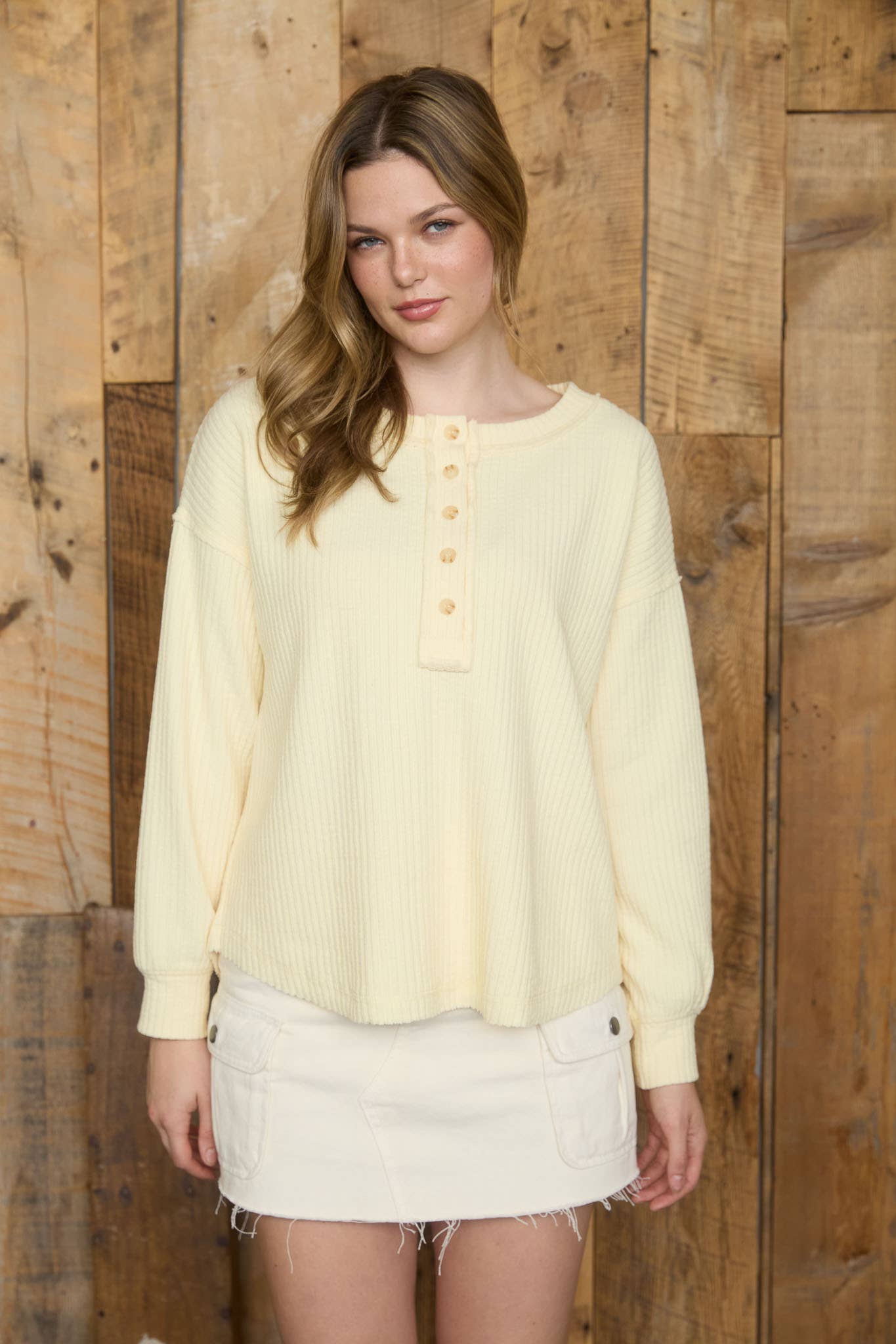 RIBBED HENLEY LONG SLEEVE EXPOSED SEAM KNIT TOP