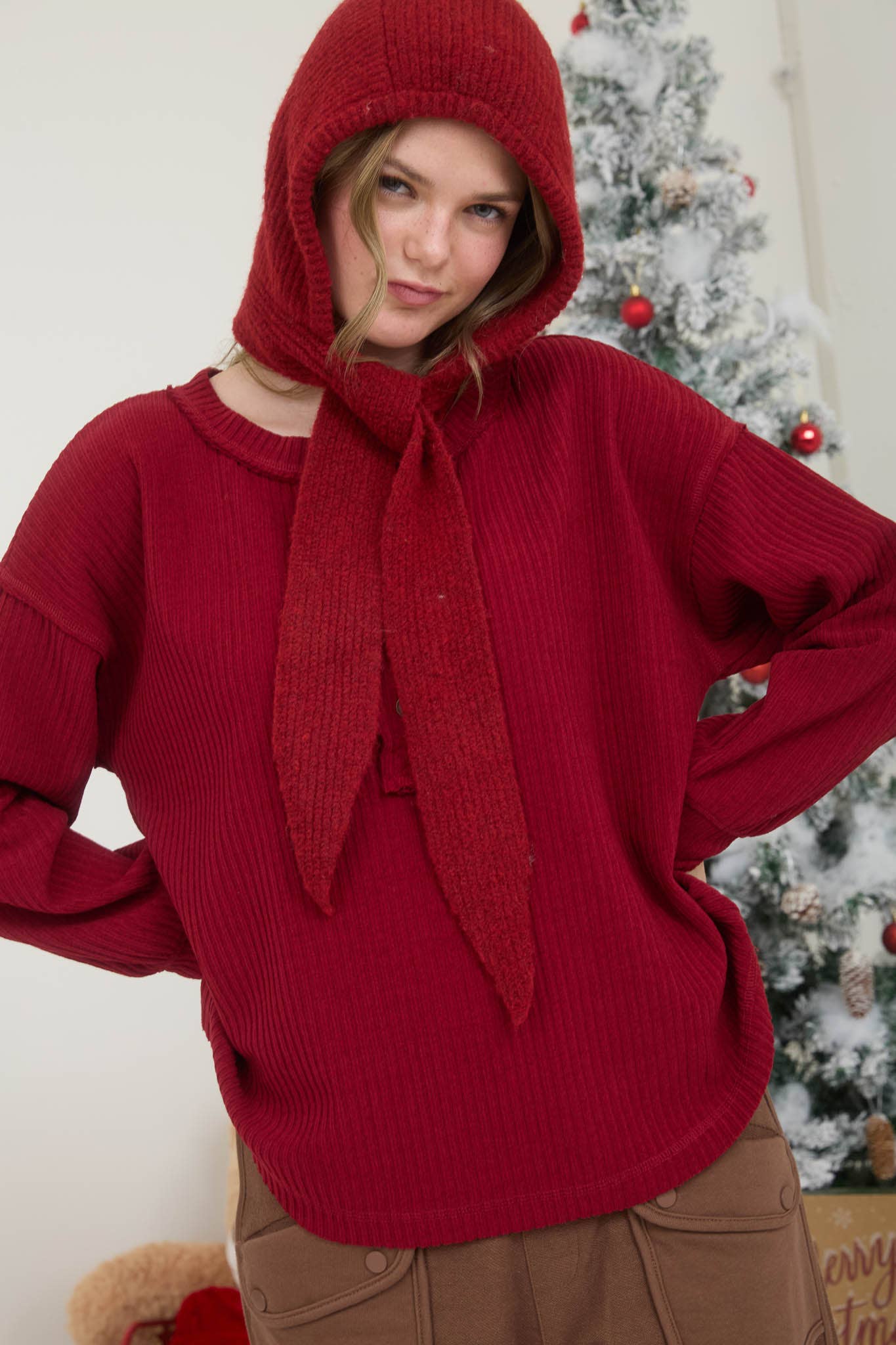 RIBBED HENLEY LONG SLEEVE EXPOSED SEAM KNIT TOP